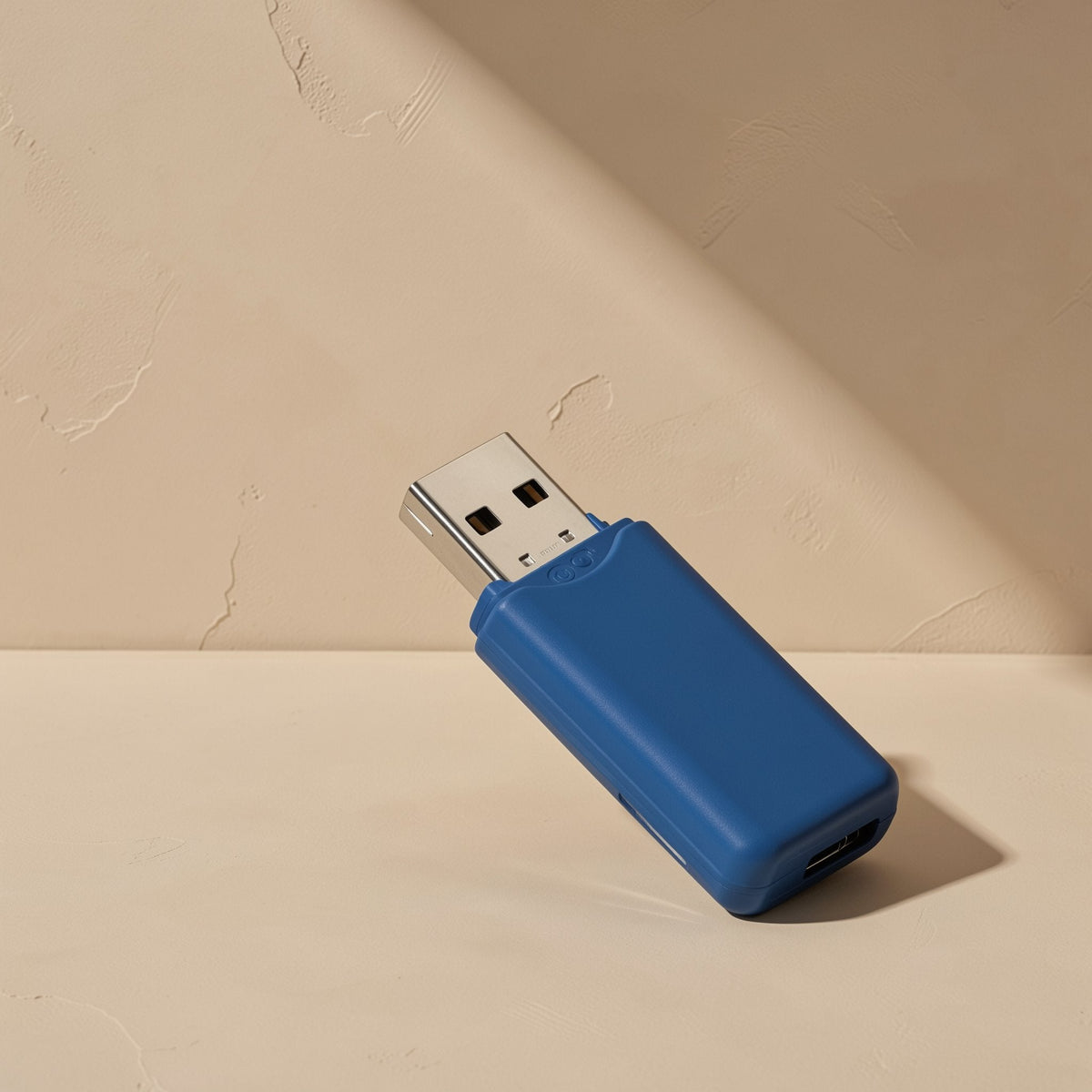 Chipdock USB 2.0 TF card reader in blue, tilted on a beige surface with a small port at the end