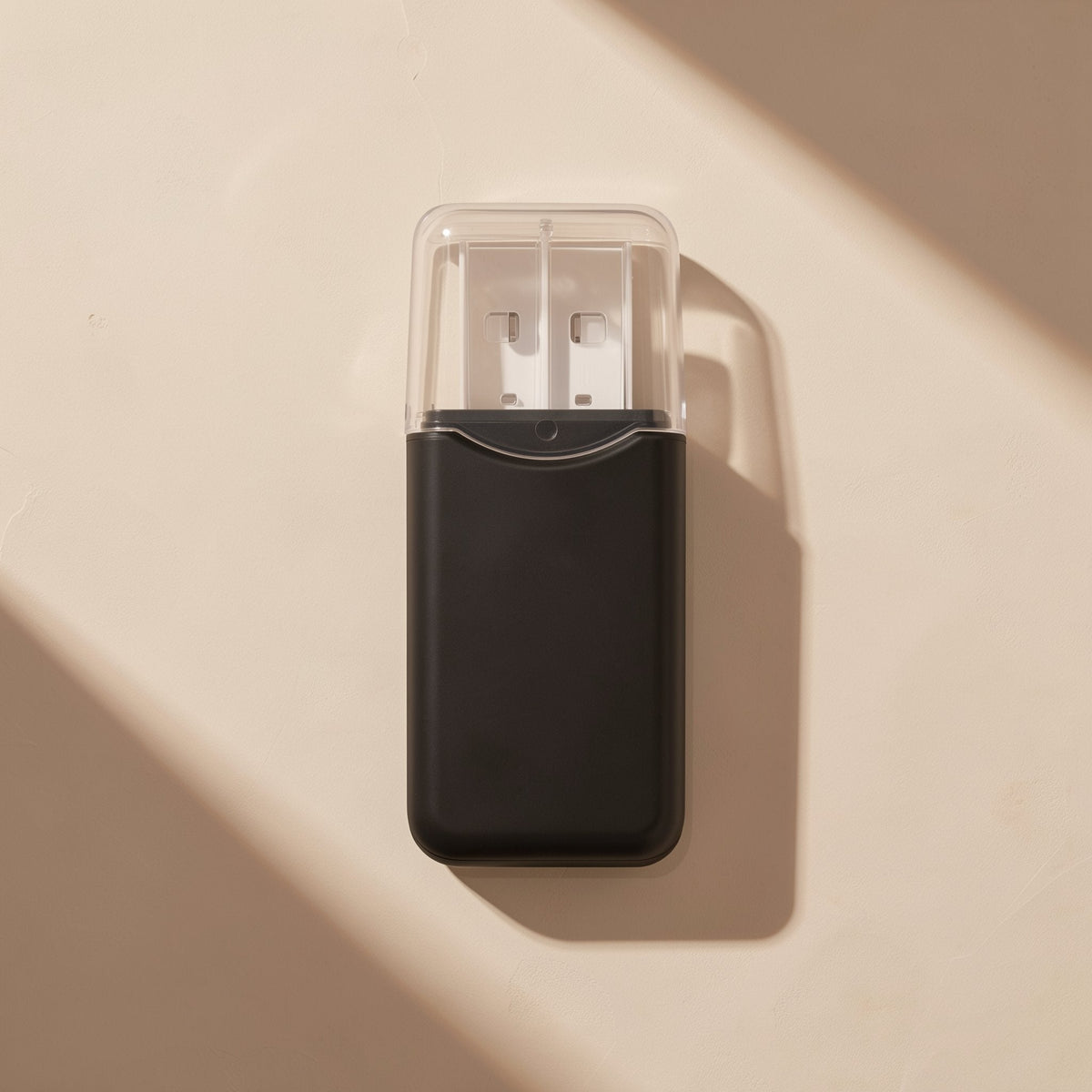 Chipdock USB 2.0 TF Card Reader – black TF card reader seen from above with a clear cap covering the USB connector