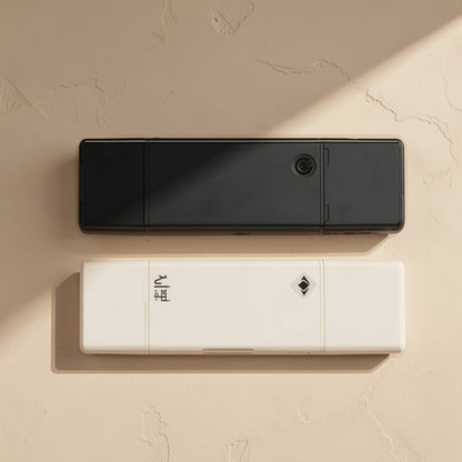 Readlink – Black and white readers stacked, showing the card slot, a small round button and an engraved diamond mark