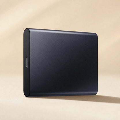 Datapocket – Navy portable SSD standing upright with USB-C port on the lower end, soft light on a cream backdrop