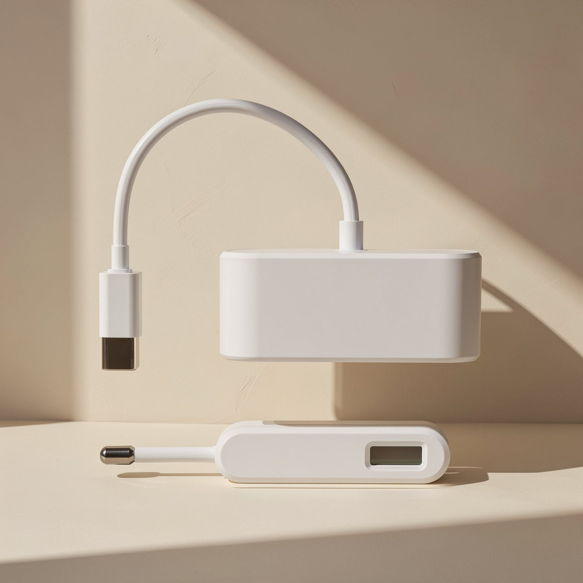 Portmate – White Type-C connector and cable with the adapter body above and a small USB device below