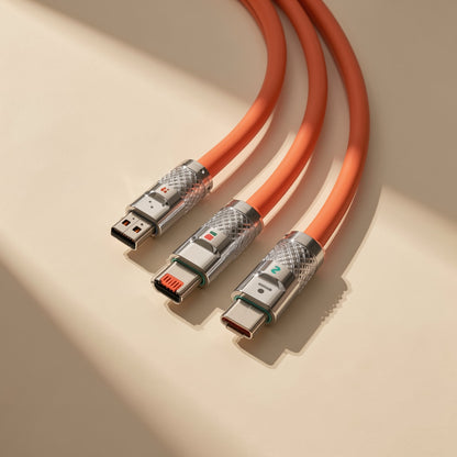 Plugtrio Three-In-One Charging Cable with orange cord and three metal connector tips on a beige surface