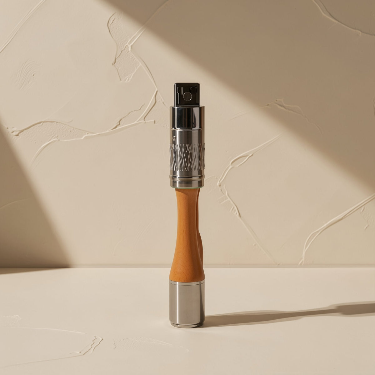 Plugtrio Three-In-One Charging Cable – upright metal and orange cable splitter junction against a plastered cream wall
