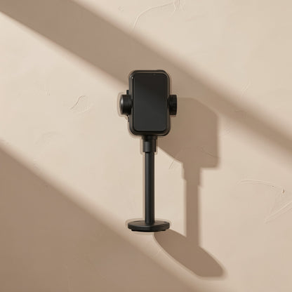 Tiltperch – Black phone bracket viewed from the front, holding a phone on a slim pole with a round base