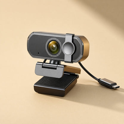 Voiceframe USB Computer Camera – rear three-quarter view of the webcam showing its attached USB-C cable and padded clip base