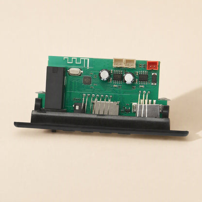 Ampcraft – Top-angled view of the green circuit board with Bluetooth antenna trace, capacitors and red connector