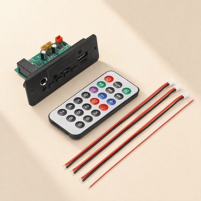 Ampcraft – Board shown with infrared remote control and three red-and-black wire leads with plug connectors