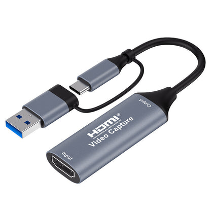 Castmate – Capture card on white background, angled view of HDMI input end and dual USB-A and Type-C cable heads