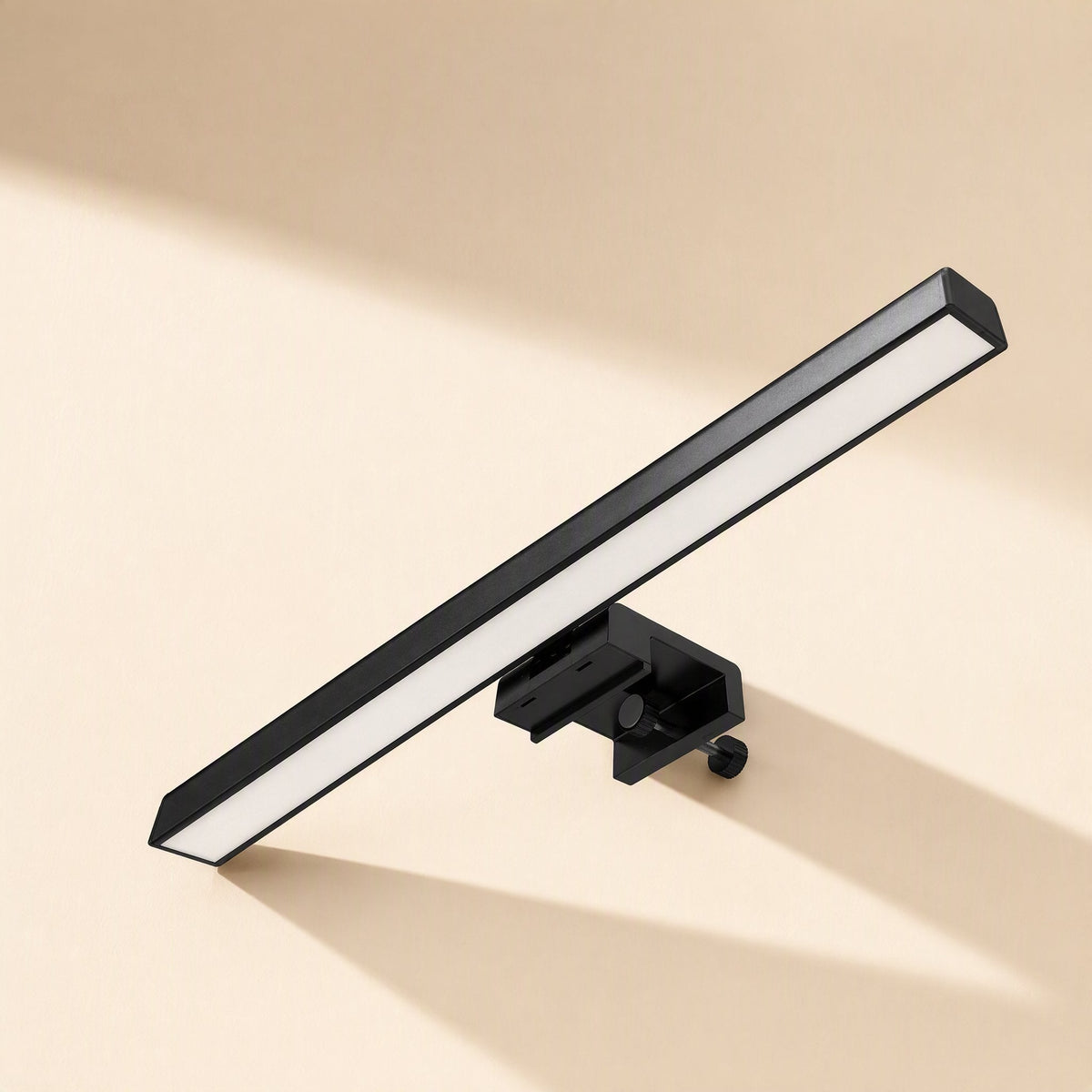 Usbglow – Black light bar tilted at an angle with a screw-tightened clamp, casting a shadow on a cream surface