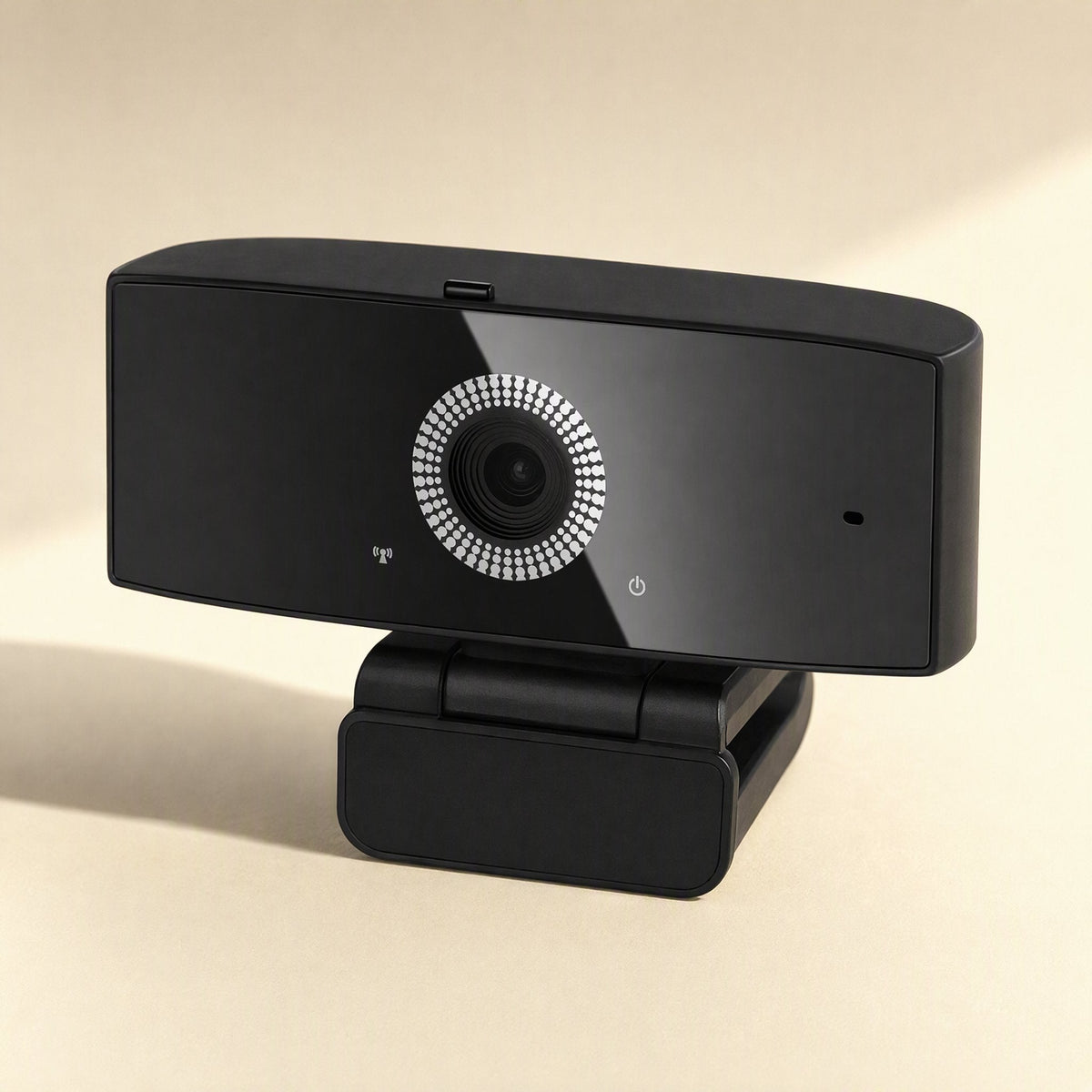 Talkframe – Black webcam with ring-lit lens and indicator icons, angled three-quarter view on its folded clip base