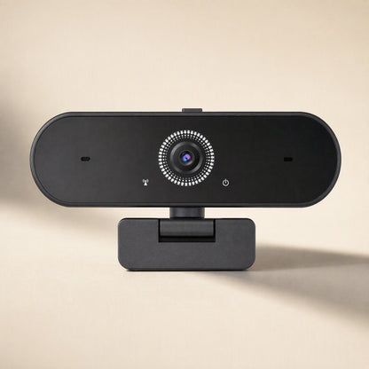 Talkframe – Front view of the black webcam on a short stand, with lens, microphone holes and power icon in focus