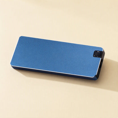 Steeldrive – Blue metal external drive lying flat, with its black end cap and brushed matte surface