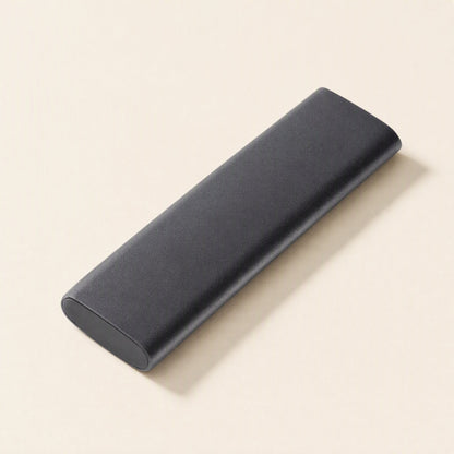 Steeldisk Metal Shell Solid State Drive – black slim metal SSD lying flat at an angle, rounded ends and matte textured finish