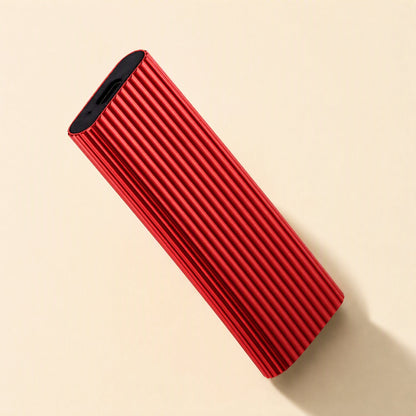 Driveswift Portable Solid State Drive – red ribbed metal drive angled to show the USB-C port on its black end cap