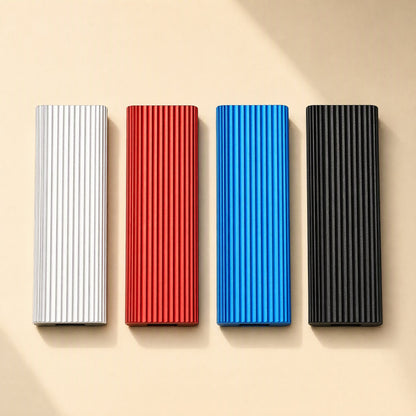Driveswift – Top-down row of silver, red, blue and black ribbed aluminum drives on a beige background