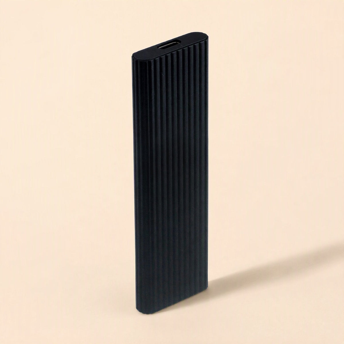 Driveswift Portable Solid State Drive – black ribbed metal drive standing upright, USB-C port visible at the top end