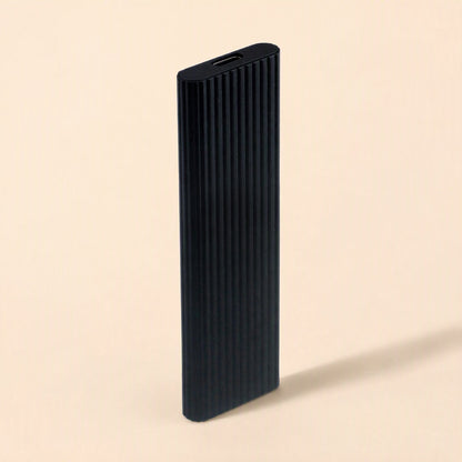 Driveswift Portable Solid State Drive – black ribbed metal drive standing upright, USB-C port visible at the top end