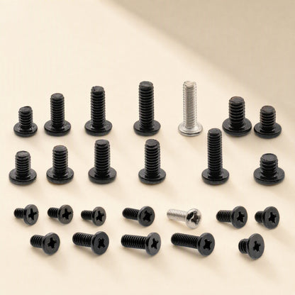 Flatfix – Close-up of black and silver Phillips screws in several lengths and head styles on a beige background