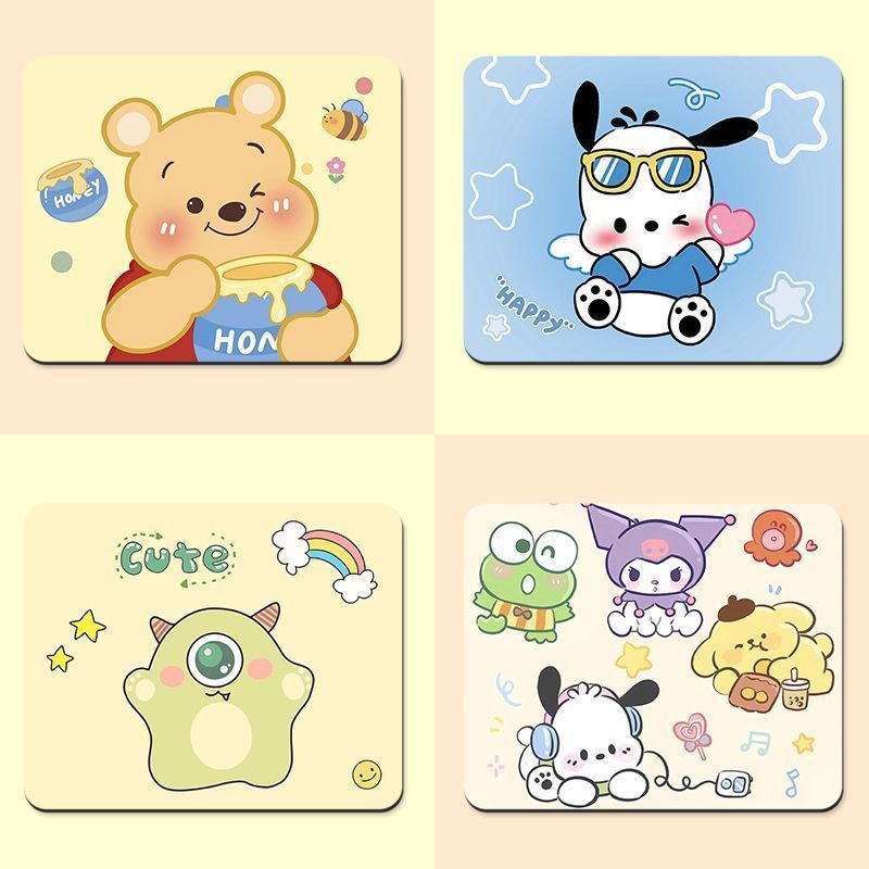 Toonpad Cartoon Desk Mat in a four-pad collage with Pooh bear, Pochacco, a green monster and Sanrio friends
