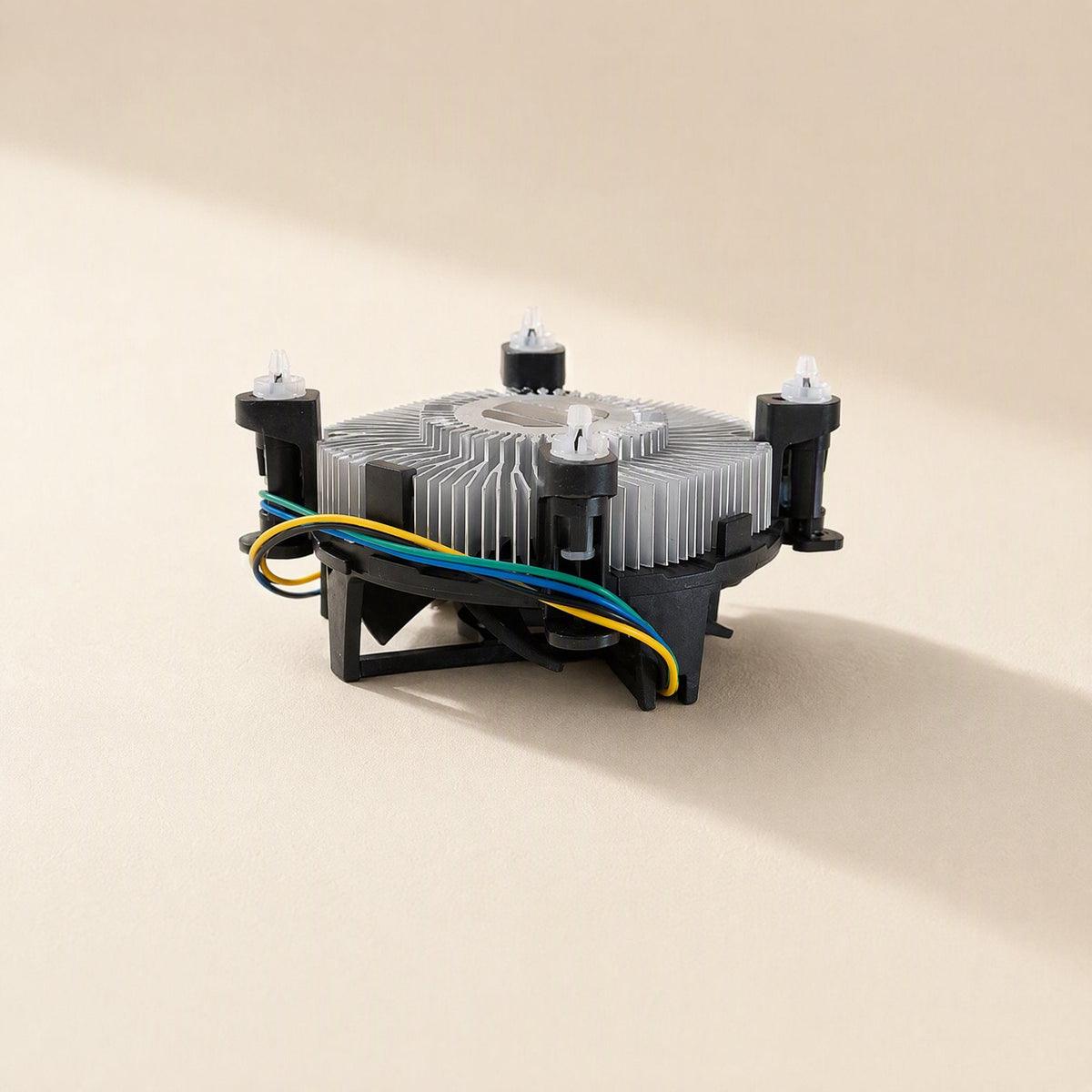 Chipbreeze – Side view of the cooler with four push-pin mounts and yellow, green and blue wires on the plastic frame