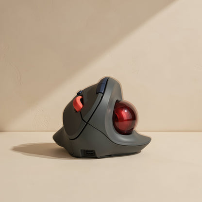 Blueloop – Thumb-side view of the mouse showing the red trackball, side buttons and a port on the base