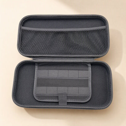 Switchstow – Inside of the gray case showing the mesh pocket on the lid and a game card holder flap with a tab closure