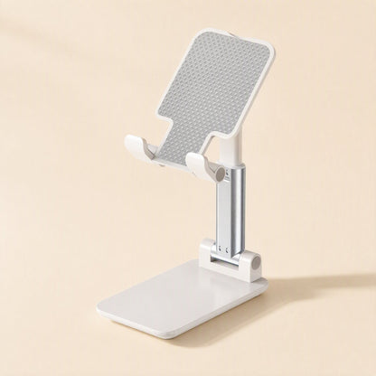 Foldangle – Front three-quarter view of the white stand with textured grey cradle, silver arm and hinged base