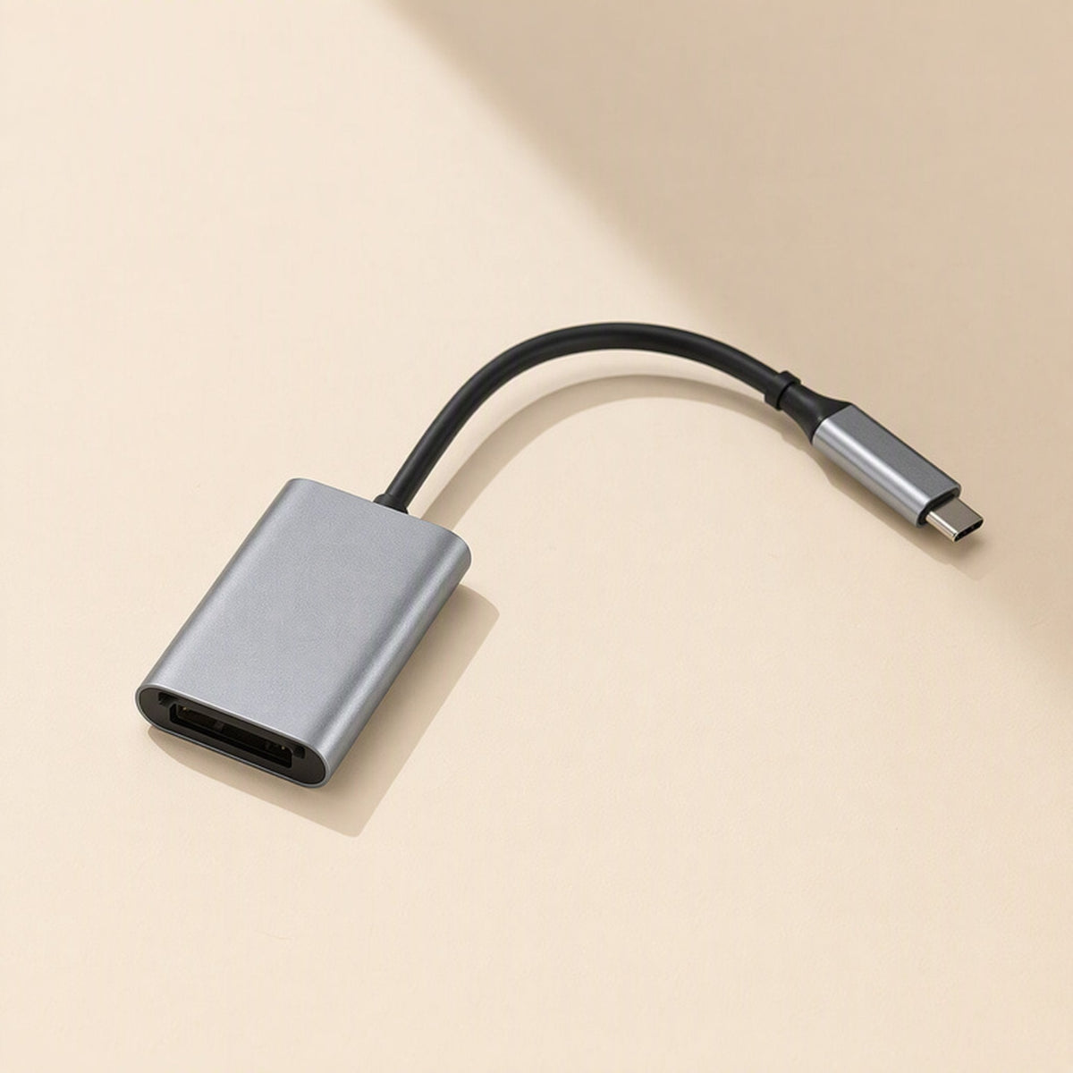 Flashread – Compact gray single-slot card reader with a short black cable ending in a USB-C connector on beige