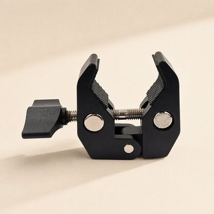 Streamclip – Side view of the open black clamp with both knurled jaws and the threaded screw rod visible