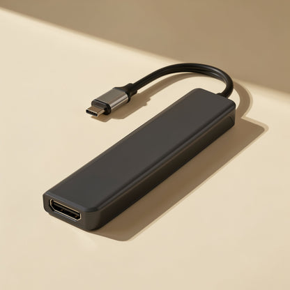 Portlink – Black hub with attached USB-C cable, front HDMI port facing the camera on a cream surface