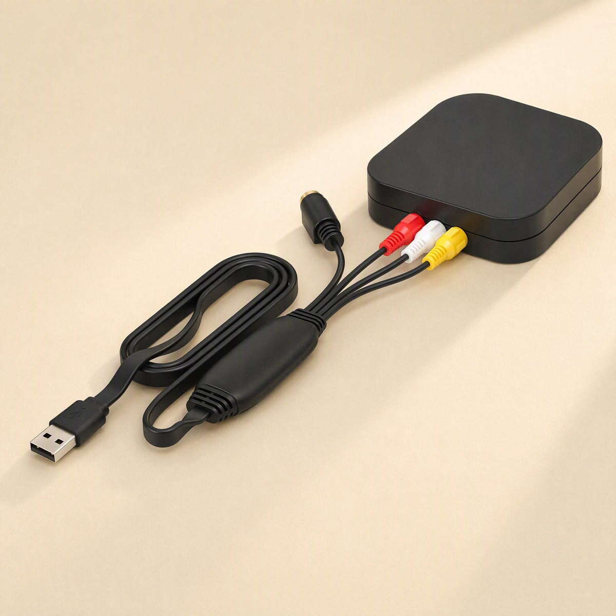 Tapeframe USB Capture Card – capture card plugged into a black media player box via red, white and yellow RCA plugs