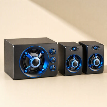 Tunespark – Side-by-side view of the subwoofer with three control knobs next to two satellite speakers, blue ring lighting