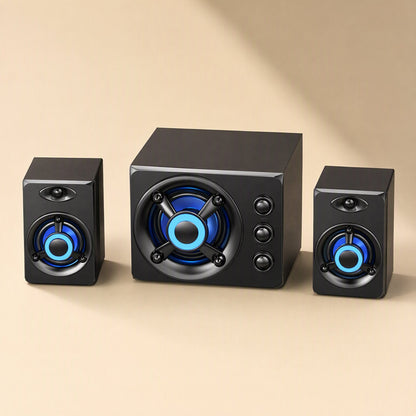 Tunespark – Front view of the speaker trio on a beige background, subwoofer between two small speakers with blue lights