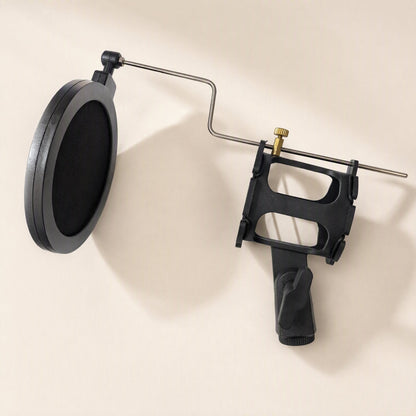 Joltclip – Black shock mount cradle with a pop filter screen attached by a bent metal arm and a brass thumbscrew