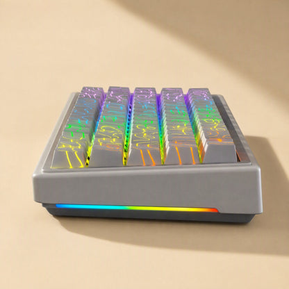 Sidescript – Side view of a gray keyboard with translucent keycaps showing rainbow contour lines lit by RGB backlighting
