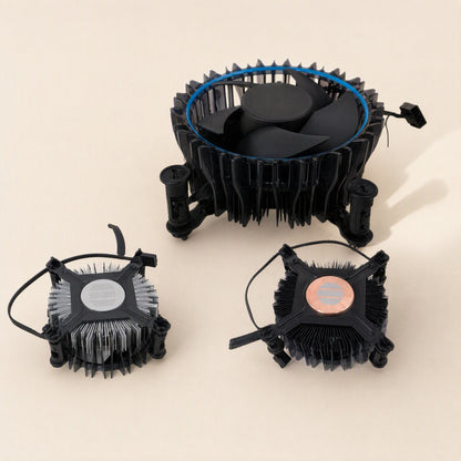 Socketcool – Three coolers on a cream surface: aluminum-base, copper-base and a large blue-ringed model with fan