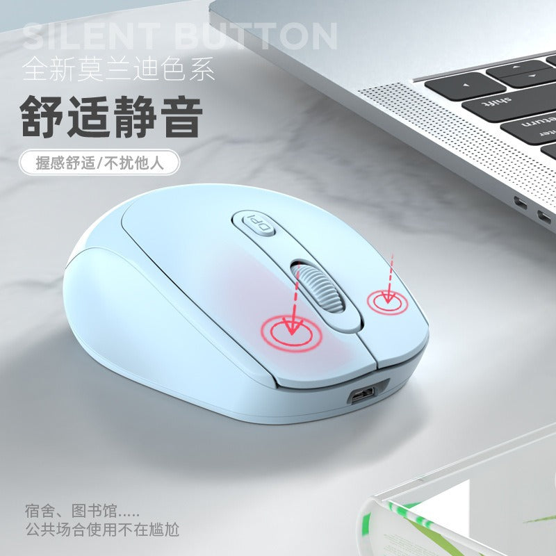 Palmclick – Pale blue wireless mouse on a marble desk beside a laptop, red arrows pointing to the two silent buttons