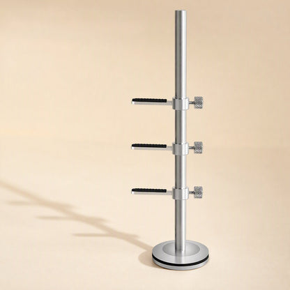 Magbrace Magnetic Graphics Card Bracket in silver with three adjustable arms on a round base, beige backdrop