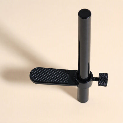 Magbrace – Black vertical post with a single textured support arm and knurled thumbscrew, close-up from above