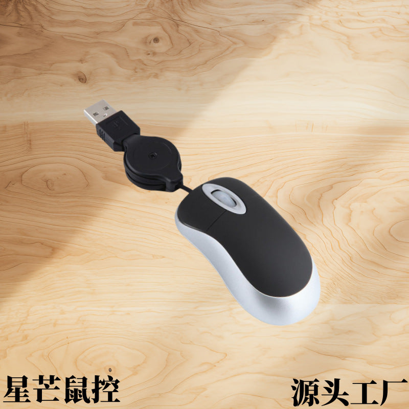 Wirereel Mini Retractable Wired Mouse in black and silver on a wood surface, USB plug and cord reel at top