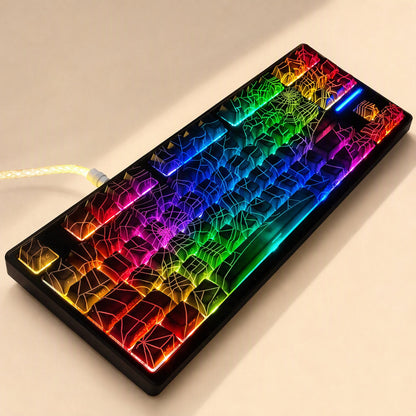 Webweave Spider Web PBT keycaps on a black keyboard with rainbow backlighting, angled view