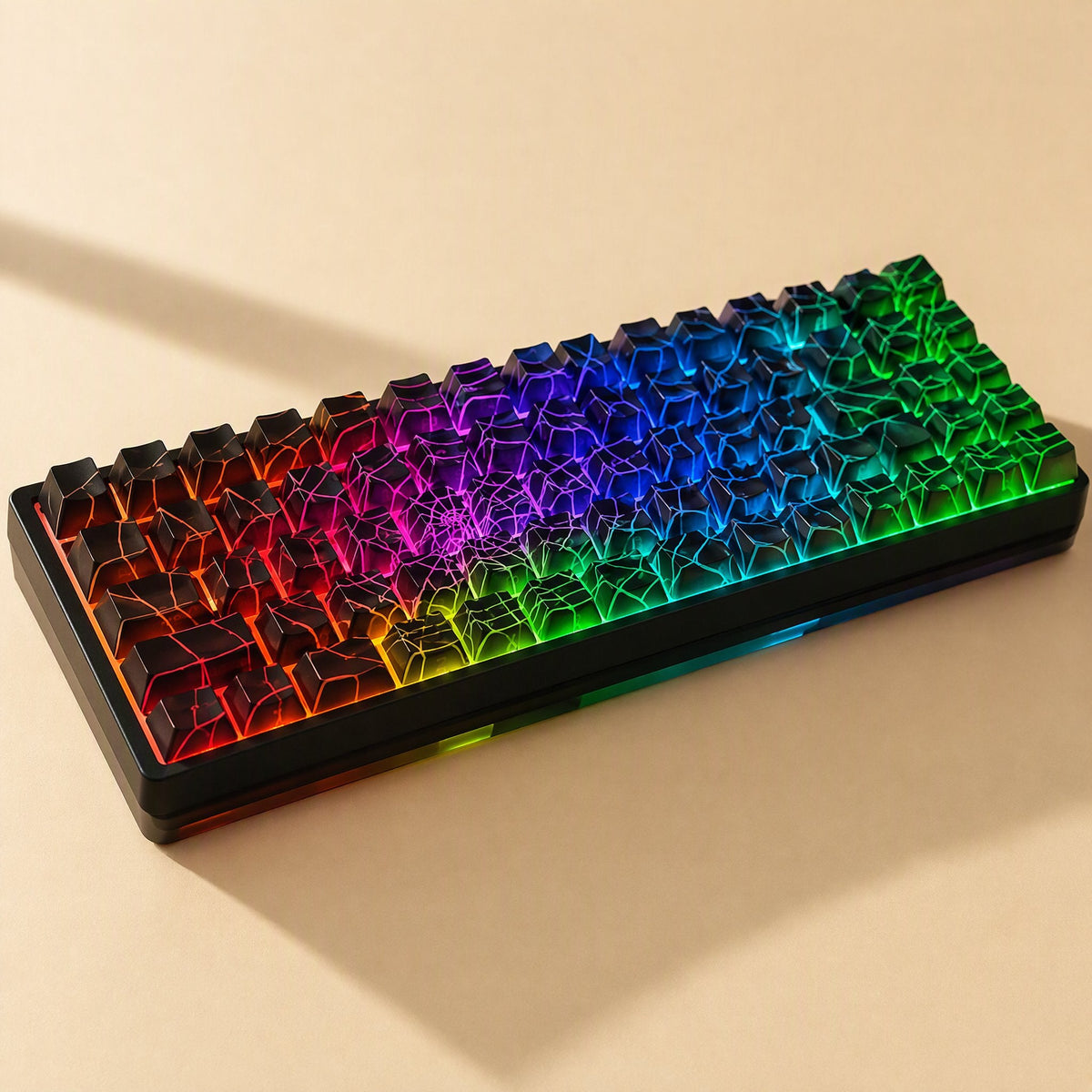 Webweave – Rainbow-lit compact keyboard fitted with black spider web keycaps, shown at a low angle