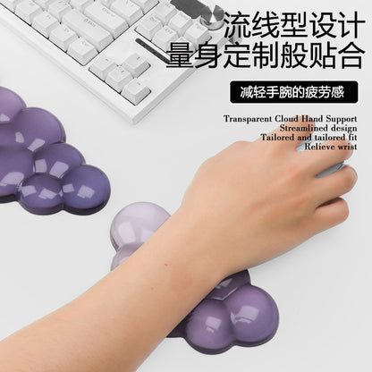 Restcloud – Hand resting on a small purple cloud wrist pad while holding a white mouse beside a keyboard