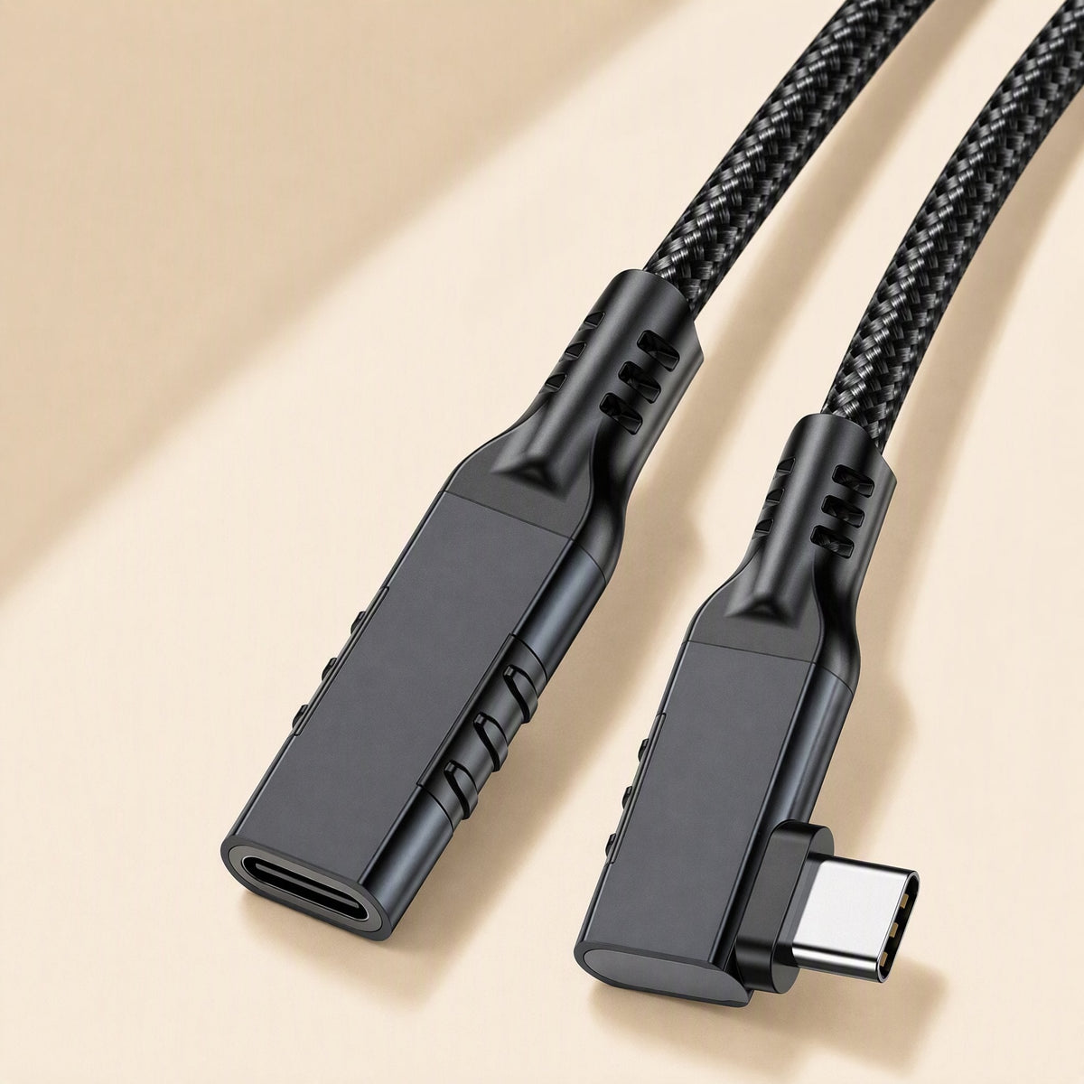 Elbowreach Right Angle Type-C Extension Cable in black, braided cord, female port and angled plug on beige