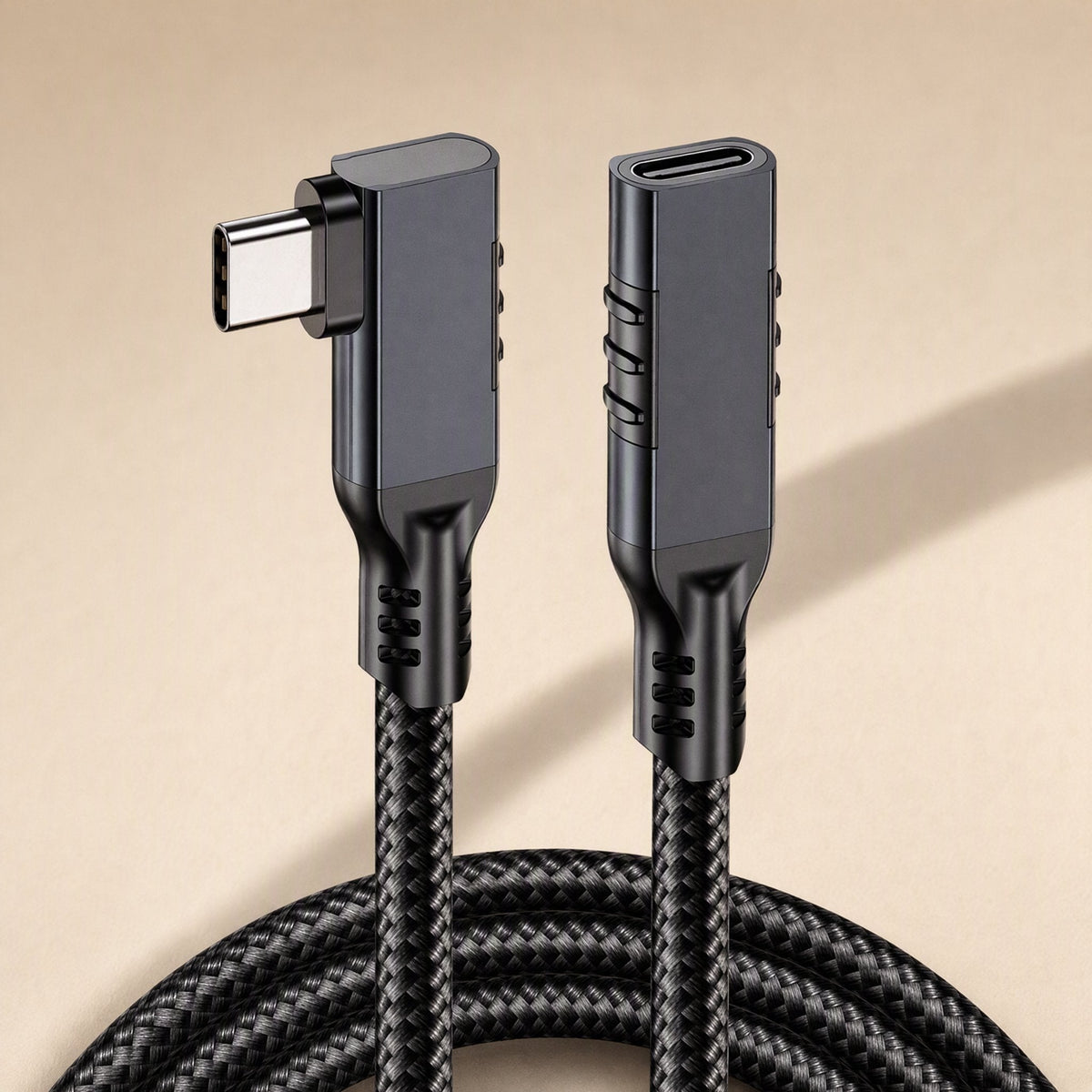 Elbowreach – Black braided cable with right-angle Type-C plug and female port connector standing upright, coiled cord below