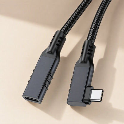 Elbowreach – Close-up of black right-angle Type-C extension cable connectors with ribbed strain relief and braided cord