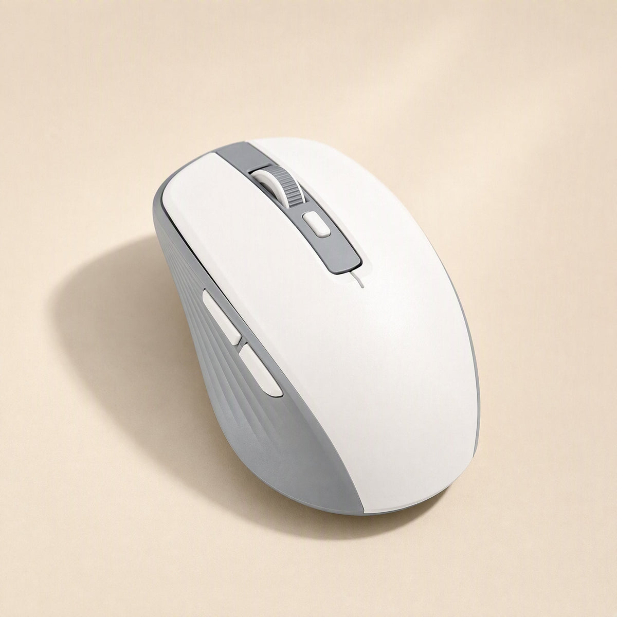 Cursorflow – White and gray wireless mouse seen from above with side buttons and a scroll wheel on a beige surface