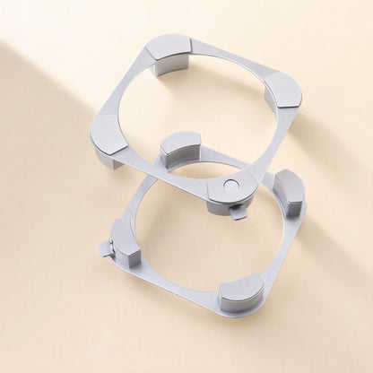 Miniperch – Two silver aluminum ring stands stacked at an angle, each with four curved feet and a small side tab