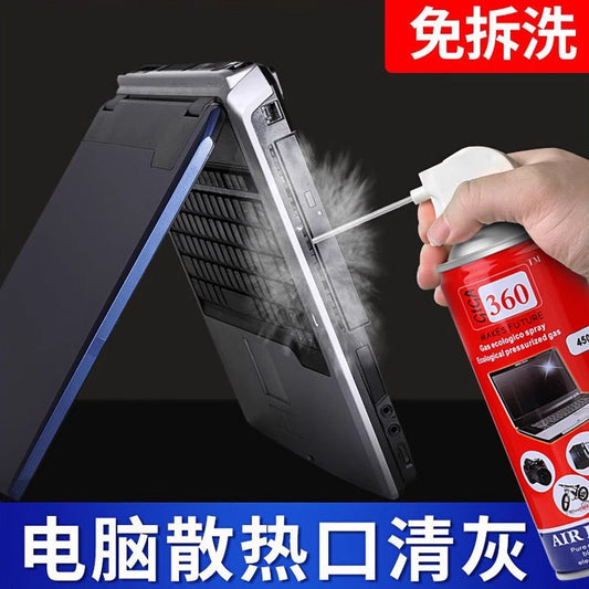 Airvane – Hand spraying a red compressed air can at the vent of an open laptop, with dust puffing out