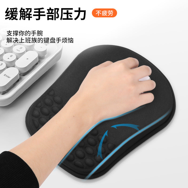 Wristlope Memory Foam Mouse Pad with Wrist Rest in black, hand on white mouse beside a white keyboard
